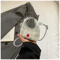 Mini borsa a tracolla a quadretti celeste con ricamo di cane e bordo in pizzo - Blu