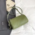 Sage green woven leather cylinder crossbody bag with adjustable strap and gold hardware - Green