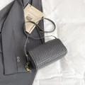Dark gray woven cylinder shoulder bag with vintage gold hardware and minimalist design - Gray