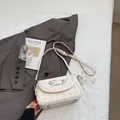 Creamy white plaid baguette bag with leather strap and decorative lace pendant - Off-white With Pendant
