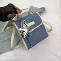 Τσάντα χιαστί από μπλε denim και λευκό δέρμα με ασημένιο αστέρι και λαβή χειρός - Με Μενταγιόν / Ζαχαρί