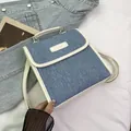 Blue denim and white leather patchwork mini backpack with top handle and metal buckle - No Pendant / Off White