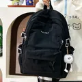 Minimalist black large capacity student backpack with cute white plush ball pendant - Black With Pendant