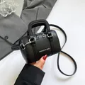 Mini black lychee pattern leather crossbody bag with silver hardware and fashion text - Black