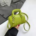 Mini lime green Boston bag in pebbled leather with silver hardware and shoulder strap - Green