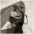 Chic black glossy shoulder bag with lace trim and cute bunny plush charm detail - Large / Black