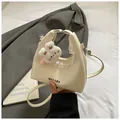 Chic cream dumpling bag with white lace trim and cute bunny plush charm for women - Large / White