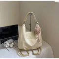 Creamy white vintage hobo tote bag with a plush bear charm and striped scarf detail - Yellow (With Pendant)
