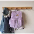 Lavender nylon drawstring backpack with yellow embroidery and multi-pocket design - Purple