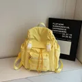 Sac à dos en nylon jaune vif avec boucles blanches et poche frontale zippée - Jaune