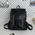 Vintage black faux leather backpack with white stitching and stylish brown buckles - Black