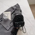 Black mini rhinestone backpack with quilted leather finish and silver chain straps - Black