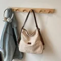 Beige large capacity canvas tote bag with brown leather straps and adjustable buckle - No Pendant / Off White