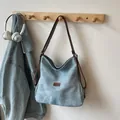 Light blue canvas tote backpack with brown leather strap and brand logo label - No Pendant / Blue