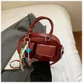 Chic red patent leather bag with twin flap pockets and colorful charms accessory - Red with Pendant