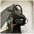 Glossy black patent leather hobo bag with cute charms and small front pockets - Black with Pendant