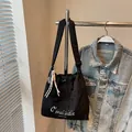 Fashionable black nylon bucket bag with embroidery and adjustable wide strap - With Charm / Black