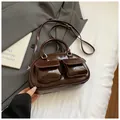 Deep coffee brown patent leather baguette bag with dual front pockets and silver hardware - Coffee without Pendant