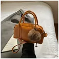Vintage caramel Boston bag in glossy leather with plush charm and adjustable strap - With Charm / Yellow Brown