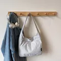 Light gray nylon tote bag with wide shoulder strap and subtle wrinkled texture design - Lime White