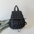 Chic black quilted bubble backpack for women featuring drawstring closure and flap - Black
