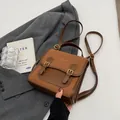 Vintage brown leather backpack with contrast trim and dual gold buckle details - No Pendant / Brown