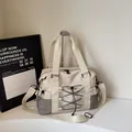 Beige nylon large travel tote with black elastic cord and mesh side pocket - White