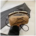 Polka dot cylinder crossbody bag with lace handles and bow accents in earth tones - Large / Khaki