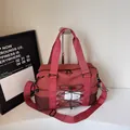Red lightweight travel tote bag for women with mesh side pocket and adjustable shoulder strap - Red