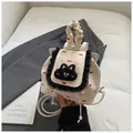 Chic beige mini backpack with red bow prints and decorative black lace trim details - White