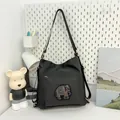 Black nylon tote bag featuring a sparkling blue and gold rhinestone elephant patch - Black
