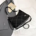 Chic black hobo bag with diamond quilt stitching and silver hardware detail - Black