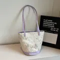 Chic butterfly print bucket bag in purple and cream patchwork for summer fashion - Purple