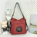 Minimalist brick red tote bag with beaded elephant pattern and adjustable strap - Red