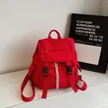 Minimalist bright red sport backpack with black buckles and drawstring detail - Red