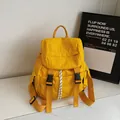 Minimalist bright yellow sports backpack with nylon texture and buckle straps - Yellow