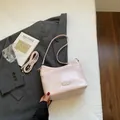 Minimalist light pink matte shoulder bag with adjustable strap and retro buckle detail - No Pendant / Pink