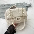 Chic off-white quilted shoulder bag with wave pattern and gold-tone chain strap - Off White