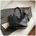 Minimalist black tote bag in glossy synthetic leather with adjustable silver buckle - No Pendant / Black