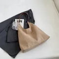 Minimalist khaki matte suede leather tote bag with a dark brown shoulder strap - Off White