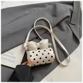 Chic white mini cylindrical bag with black polka dots and large bow detail - White