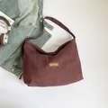 Retro deep burgundy denim hobo bag featuring our fave tag and wide shoulder strap - Brown