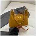 Mustard yellow quilted suede crossbody bag with vintage gold hardware and chain strap - Yellow