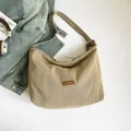 Vintage khaki canvas hobo bag with our fave leather patch and denim accents - Khaki