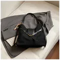 Minimalist black suede tote bag with gold metal hardware and beaded pendant detail - With Charm / Black