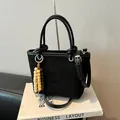 Black matte suede tote bag with wooden bead charm and adjustable shoulder strap - Black With Pendant