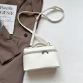 Chic white small square handbag in lychee texture with crossbody strap and silver hardware - Off White
