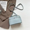 Pale blue litchi pattern square handbag with adjustable strap and silver zippers - Blue