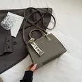 Olive green woven small square bag with leather straps for commuter chic styling - Green