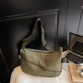 Minimalist olive green crossbody bag with adjustable strap and multi-pocket design - Green